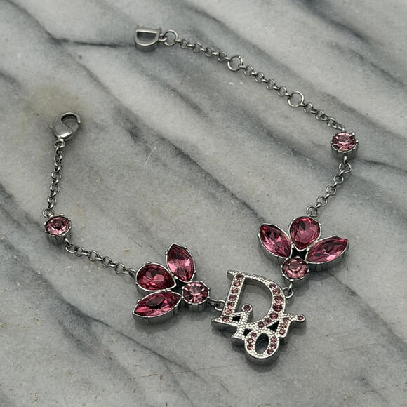 CHRISTIAN DIOR PINK CRYSTAL LOGO BUTTERFLY BRACELET - Picture 2 of 6